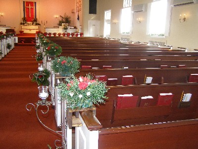 Pews are decorated for Christmas